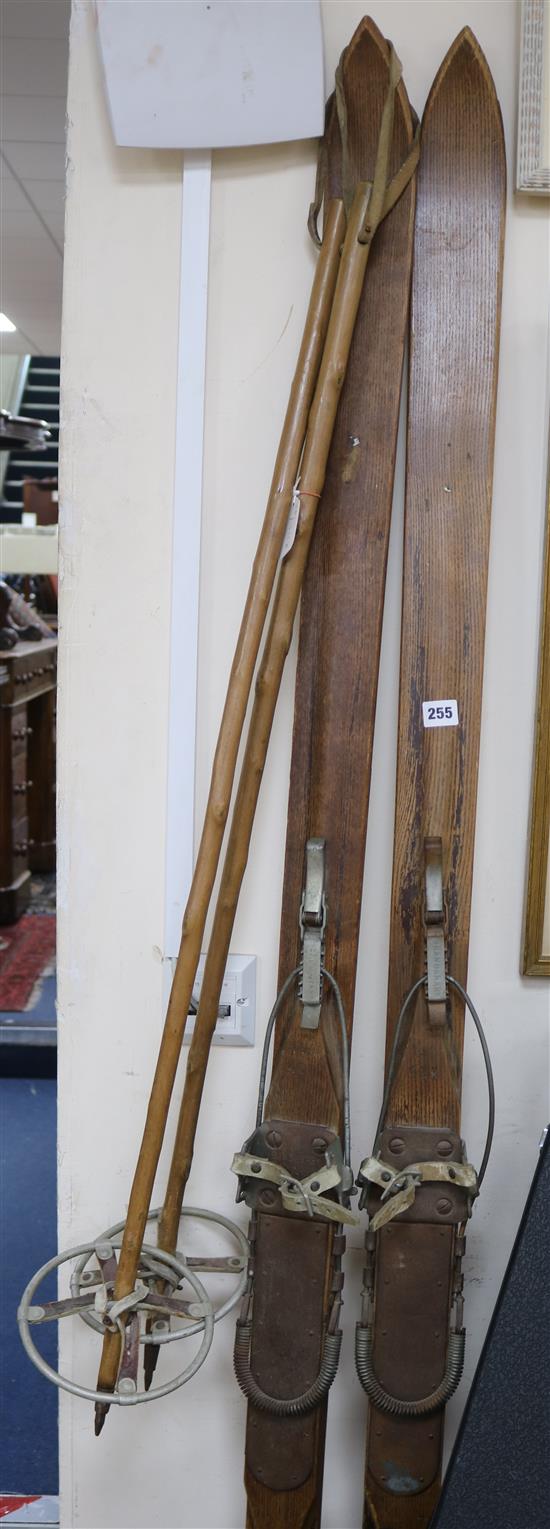 A pair of wooden skies and wooden poles length 189cm